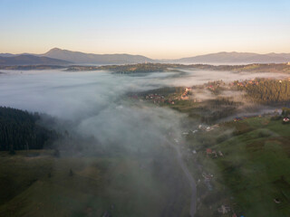Fototapeta premium Morning fog in the Ukrainian Carpathians. Aerial drone view.