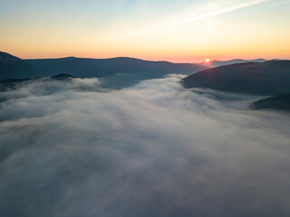 Sunrise over the fog in the Ukrainian Carpathians. Aerial drone view.