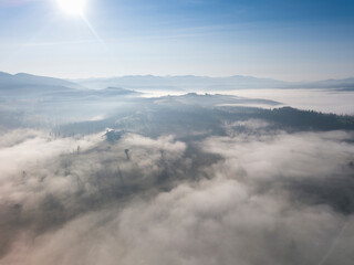 Naklejka premium Morning fog in the Ukrainian Carpathians. Aerial drone view.
