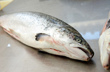 Red salmon fish. Salmon carcass on the table. Healthy eating red salmon fish. Photo on fish production.