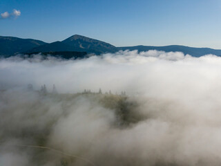 Morning fog in the Ukrainian Carpathians. Aerial drone view.