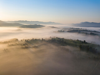 Morning fog in the Ukrainian Carpathians. Aerial drone view.