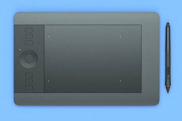 Graphic tablet and pen for illustrators, designers and photographers on blue
