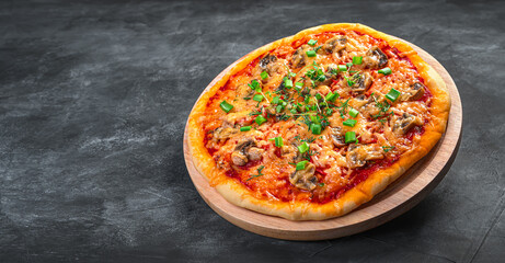 Juicy pizza with mushrooms, tomatoes, cheese and fresh herbs.