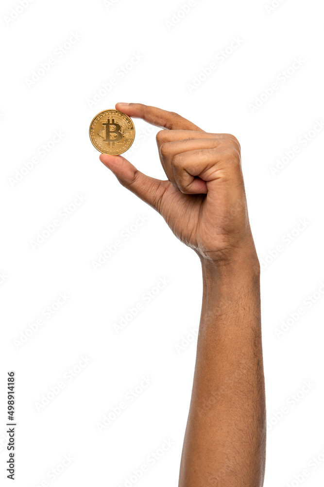 Wall mural cryptocurrency, finance and business concept - close up of female hand holding golden bitcoin over white background - Wall murals