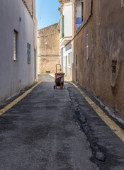 Fototapeta na wymiar Wheelie garbage can in an alley