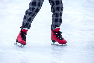 feet on skates on an ice rink. winter sport and recreation