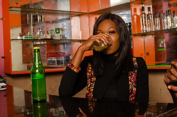beautiful lady in the bar having some drink