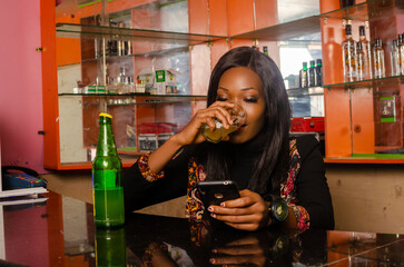 beautiful Alcoholic lady using her cellphone