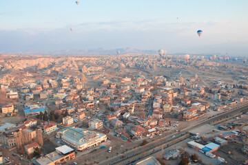 Landscape of Cappadocia Goreme with hot air balloons, aerial view