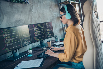 Profile portrait of serious smart web designer sitting chair keyboard write edit database workplace...