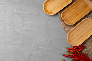 Empty wooden plate on kitchen table, top view