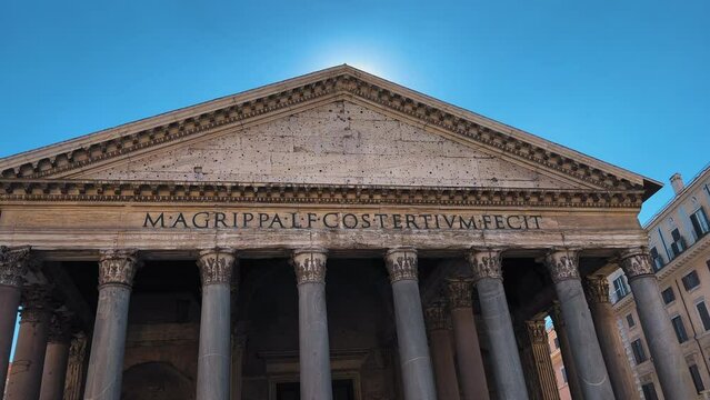 Panning shot of The Pantheon Building against blue sky in summer in Rome,Italy