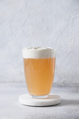 Chinese Cheese Tea with layer of creamy foam on white background. Asian trendy beverage. Thai milk tea. Close up.