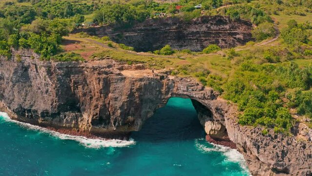 Beautiful Bali beach, Broken Beach (Pantai Pasih Uug) Devil's Billabong  with scenery stone bridge and nature pool on nature background Bali, Indonesia 4K