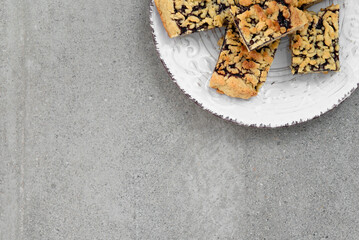 Cookies with jam in the upper right corner. Cookies on a beautiful white plate.