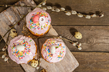 Traditional Easter cake. Festive sweet food with icing and decor. Eggs, nest, willow