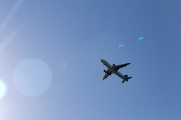 Fototapeta na wymiar Passenger plane in the blue sky - Air travel