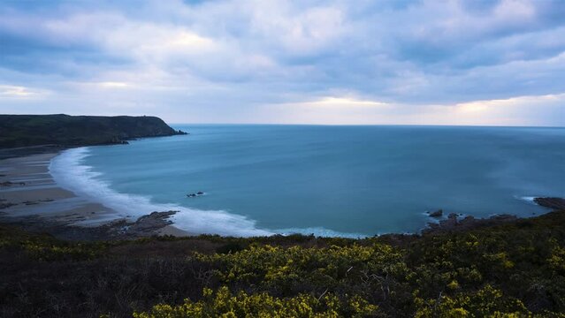 La Hague, France, Timelapse - Wide angle view of the Baie d Ecalgrain in Auderville at dusk