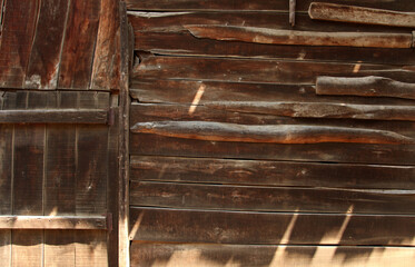 A door in the wall of an old wooden house