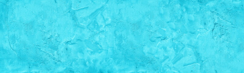Bright aqua blue old rough cement plaster surface wide panoramic texture. Turquoise shabby exterior...