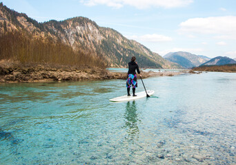 Spring paddle at bavarian mountain lake