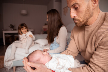 Obraz premium Family happy to enjoy of the newborn in the livingroom