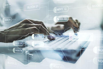 Double exposure of abstract creative programming illustration with world map and hand typing on laptop on background, big data and blockchain concept