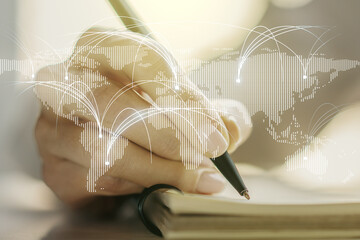 Abstract graphic digital world map with connections and woman hand writing in diary on background, globalization concept. Multiexposure