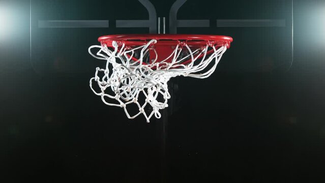 Super slow motion of basketball ball hitting the basket. Filmed on high speed cinema camera, 1000fps. Speed ramp effect.