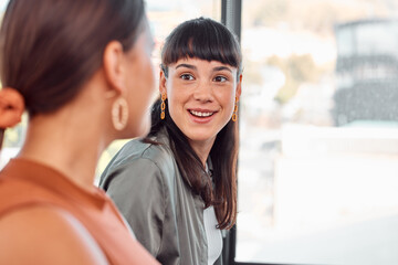 Did you do the assignment. Shot of two young businesspeople talking in an office.