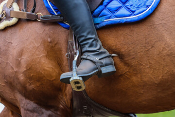 Horse riding leg spurs close-up - obrazy, fototapety, plakaty