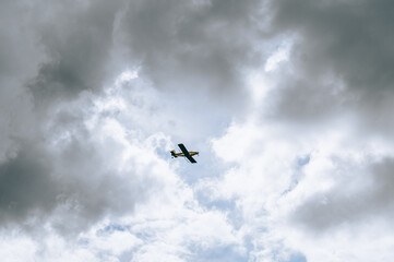 airplane in the clouded sky