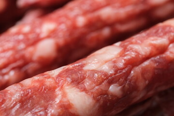 extreme close up of Chinese sausage (Lap cheong). Traditional dried, hard and seasoned sausage in China. Macro of food