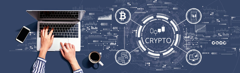 Obraz na płótnie Canvas Crypto Trading theme with person using a laptop computer