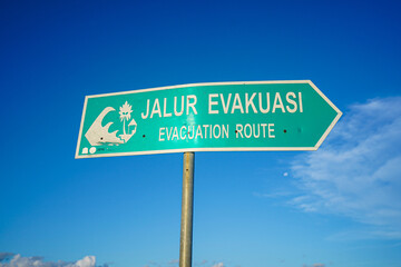 A sign directing people to a place safe from the tsunami.