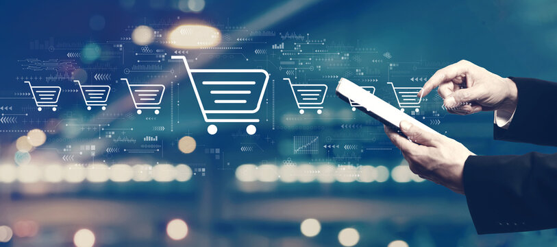 Online shopping theme with businessman using a tablet computer