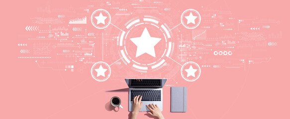 Rating star concept with person working with a laptop