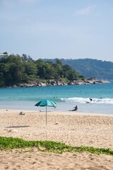 Landscape clean sea Umbrella on beach mountain background.