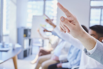 We have questions. Cropped shot of a group of businesspeople raising their hands during a meeting.