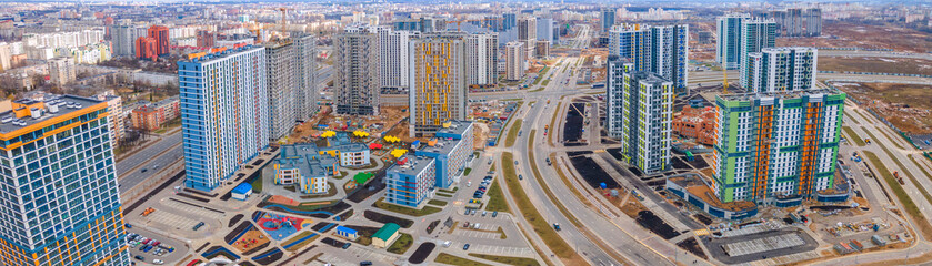 Fototapeta premium New multi-storey residential building apartment houses aerial view with children playground. City neighbourhood.