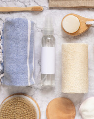 Organic natural cosmetics and zero waste reusable accessories for skin and hair care on marble