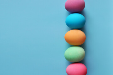 Preparation for the Easter holiday. Eggs and Easter decor on a bright background.