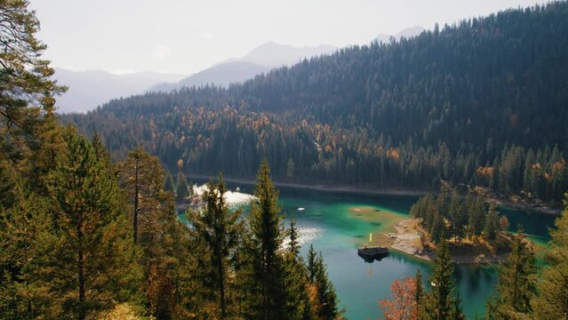 lake cauma in switzerland in autumn with pines and larches