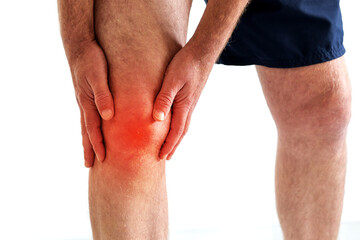 a man got injured holding on knee because of pain from overuse knee or workout, explain hurt area...