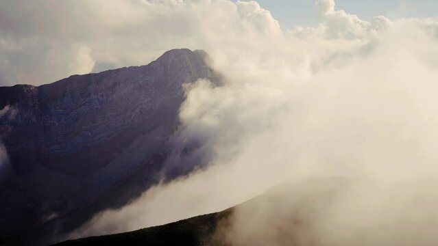 timelapse of clouds rolling over mountains in switzerland