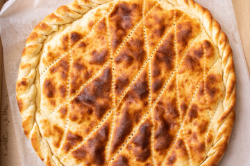 Ruddy Ossetian closed pie in the box