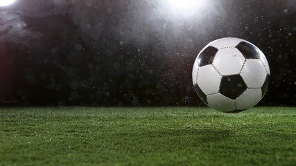 Fototapeta na wymiar Close-up of Falling Soccer Ball on Football Field
