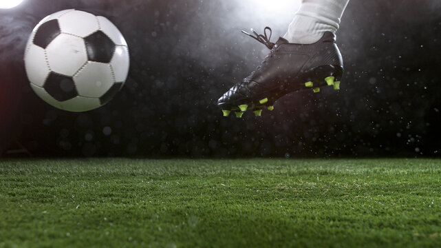 Close-up of Football Player Kicking Soccer Ball