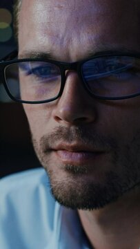 Vertical Screen. Close-up Portrait of Software Engineer Working on Computer, Line of Code Reflecting in Glasses. Developer Working on Innovative e-Commerce Application using AI Algorithm, Big Data